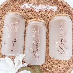 three personalized mason jars sitting on top of a wicker basket