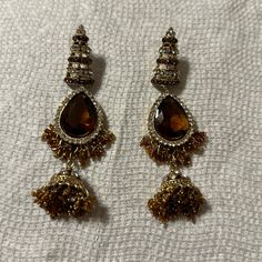 Elegante Womens Indian Style Earrings Color Gold Brown Old Buttalu Earrings Gold, Gold Jhumka Earrings Bridal Antique, Formal Metal Earrings With Latkans, Elegant Brown Chandelier Earrings, Brown Beaded Drop Earrings For Party, Elegant Brown Earrings For Party, Brown Dangle Earrings For Party, Latkan Drop Earrings For Party, Elegant Brown Metal Beaded Earrings