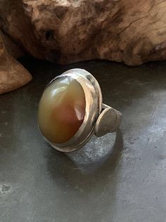 This is an absolutely gorgeous, vintage, sterling silver (stamped) ring with what I believe to be an agate stone. The face of the ring measures 1 inch tall and 7/8 inch wide. The ring has the artist's initials but I was unable to identify the maker. The ring is size 7.  Weight: 14.4g Stamped Ring, Stamped Rings, La Face, Agate Ring, The Maker, Vintage Ring, Agate Stone, Rings Statement, Vintage Sterling Silver