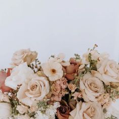 a bouquet of flowers sitting on top of a table