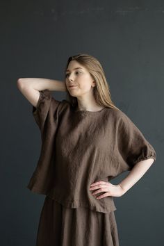 Tunic is made from 100% soft and washed linen. Match it with our skirts! Details: - Composition: 100% Oeko-Tex certified linen - Colour: cacao - Button in the back - Dropped shoulders - Size: One size/fits all - Medium weight linen - Linen care: machine wash gentle; tumble dry low, ironing optional - The price is for one tunic, other pictured items are not included Measurements: Length from neck down: 55 cm (21,66 in) Chest width: 140 cm (55,1 in) Sleeve length (from collar): 37 cm (14,6 in) Bot Brown Relaxed Fit Top For Daywear, Oversized Brown Blouse With Short Sleeves, Brown Oversized Short Sleeve Blouse, Oversized Short Sleeve Brown Blouse, Oversized Linen Shirt, Below The Knee Skirt, Summer Tunic, Plus Size Shirt, Loose Tunic