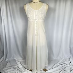 Vintage 90s sleeveless white nylon baby doll style nightgown slip dress  Some small snags, please see photos Mannequin is a 6/8 Bust 34 in Waist 36 in Hips 40 in Length 50 in Fitted Sleeveless Vintage Nightgown, Mesh Slip Dress, Sleeveless Cotton Vintage Nightgown, Coquette V-neck Nightgown With Lace Trim, Vintage Sleeveless Cream Nightgown, Coquette Lace V-neck Nightgown, Women's Nightgowns, Pajama Robe, Ribbon Bow