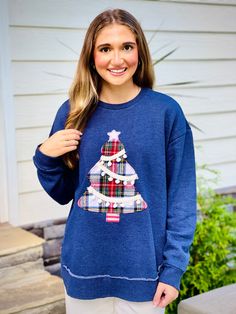 This Christmas Tree Pom Pom Sweatshirt is the perfect addition to your festive wardrobe. The soft fabric will keep you warm and cozy during the holiday season. The festive pom poms on the Christmas tree design add a playful touch to this sweatshirt. Spread holiday cheer with this fun and stylish sweatshirt. Fabric::: 60% cotton 40% polyester Brand::: Royce Christmas Tree Pom Pom, Upcycle Inspiration, Quilted Clothing, Sweatshirt Refashion, Boutique Trends, Sweatshirt Fabric, Christmas Tree Design, Tree Design, Maxi Dresses Casual