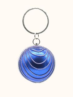 a blue beaded ball hanging from a metal ring on a white background with clippings