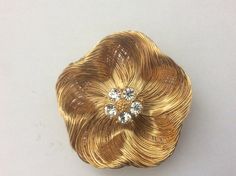 "Monet gold plated wire, clear rhinestone flower brooch Excellent condition diameter - 2 1/8\" 00241" Gold Flower-shaped Jewelry With Rhinestones, Gold Floral Jewelry With Rhinestones, Gold Jewelry With Rhinestones In Flower Shape, Gold Flower-shaped Brooch With Rhinestones, Gold Flower-shaped Rhinestone Brooches, Gold Flower-shaped Brooches With Rhinestones, Gold Flower Brooches With Rhinestones, Gold Flower Brooch For Wedding, Gold Flower Jewelry With Rhinestones