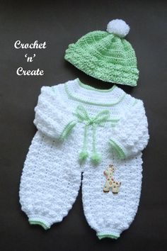 a crocheted baby outfit and hat with a giraffe on it