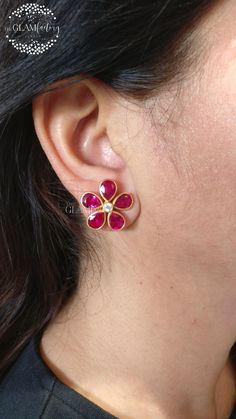 A gorgeous flower shape lab created Ruby and best 5A quality cubic zirconia stud earrings pair made in guaranteed Sterling Silver 925 (stamped) with real 18k gold filling, matte look, perfectly finished and made. Size of lab created ruby used is 8mm x 6mm, size of cubic zircon is 3.00 mm. Gold Filling is completely different from Gold Plating as gold filling contains 100% gold which does not go away easily and enhances the life and look of the jewelry. Plating we used is 100% LEAD & NICKEL FREE Gemstone Flower Earrings For Anniversary, Flower Studs Earrings, Star Ruby, Studs Earrings, Diamond Flower, Flower Earrings Studs, Ruby Diamond, Flower Studs, Flower Shape