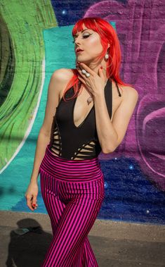 The Pink & Black Stripe Big Bells are your go-to stylish everyday pant. Dress these flattering pants up or down- truly perfect for almost any occasion. Design Features: High waistband hits comfortably at your true waist Waistband can be rolled down to expose belly Perfectly hugs hips Pant leg flares into large bells Fantastic garment to dress up and down. Incredibly vibrant print. Made in San Francisco, CA, USA Fabric Features: Radical vertical Pink and Black stripe. Moisture Wik Polyester/Spand Black 4-way Stretch Bottoms For Night Out, Black 4-way Stretch Bottoms For Spring, Black High Stretch Yoga Pants For Summer, Edgy Black Workout Bottoms, Edgy Stretch Elastane Pants, Edgy Fitted Summer Pants, Black Athleisure Yoga Pants For Summer, Black Bottoms With Wide Waistband For Night Out, High Stretch Athleisure Pants For Night Out