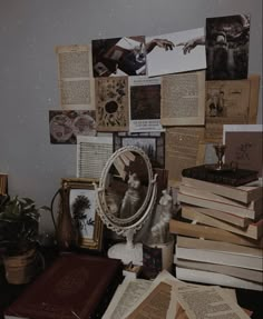 an assortment of books and pictures on a table