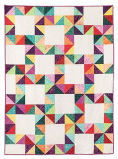 a multicolored quilt is shown on a white background