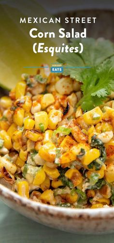 mexican street corn salad esqquites in a bowl with cilantro and parsley