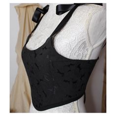 Black embroidered jacquard fabric corset style top with adjustable shoulder straps and back tied with ribbons. Soft Jacquard fabric.   Handmade to order. More colours available in our shop. Each order is handmade and shipped from our studio in Ireland and every order shipped comes with a tracking number.  This stunning corset style top has soft boning to give the front structure and lined with a beautiful soft satin for comfort.  -Not a hard structured corset.  -see our size chart to help assist in selecting a size and measurements. Measurements are in inches and UK sizing.  Handmade in our studio in Ireland  Uk size XS 4-6,  S 8-10, M 12-14, L 16-18. Style for many events such as festivals, date night, costumes, birthdays, valentines, Christmas, Halloween, parties and more.  We can't wait Boned Bodice For Costumes, Lace Corset With Lace-up Back And Fitted Bodice, Underbust Lace-up Back Corset Belt, Underbust Corset Belt With Lace-up Back, Evening Underbust Corset With Adjustable Straps, Sleeveless Costume Corset, Lace Festival Corset, Festival Lace Fitted Corset, Fitted Sleeveless Bodice For Costume