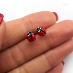 These little and neat ladybug earrings were lovingly made by hand. Earrings are pretty light and they are great for daily wearing. The size of a ladybug about 7*5 mm (0.3*0.2 in)They are handmade, without using a mold, so the size may vary a little.♥ Ladybug Ring https://www.etsy.com/listing/661389811/ladybug-ring-red-tiny-adjustable-ringOther earrings you can see here: https://www.etsy.com/shop/RinaStudioDesign?section_id=24005662• Submersion in water is not recommended for polymer clay as this Miniature Earrings, Violet Jewelry, Ladybug Earrings, Lemon Earrings, Ladybug Jewelry, Small Purple Flowers, Diy Earrings Polymer Clay, Fruit Jewelry, Steel Post