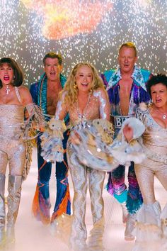 a group of people dressed in disco outfits