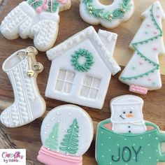 decorated christmas cookies on a wooden platter