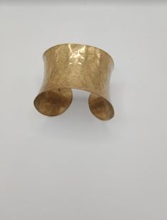 A beautiful brass cuff bangle hammered technique, simple and elegant. Elegant Hammered Brass Bangle, Elegant Hammered Cuff Bracelet Gift, Elegant Hammered Cuff Bracelet As Gift, Elegant Hammered Brass Cuff Bracelet, Hammered Gold Bangle As Gift, Hand Forged Gold Cuff Bracelet As Gift, Hammered Metal Cuff Bracelet, Bronze Hammered Bracelet As Gift, Hand Forged Brass Cuff Bracelet For Gift