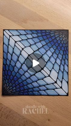 a wooden floor with a blue tile pattern on it and a video player in the center