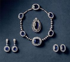 Queen Alexandrine' s blue sapphire necklace set, earring, pendant brooch, stud earring, gift for her wear by Queen Margreth  Metal:Sterling Silver  Metal Purity:925 Necklace Metal weight: 87.99 gram Stone : Cubic zirconia  Stone Ctw:24.90ctw Gemstone:blue sapphire  Gemstone weight: 55.99 ctw Item length: 17 inch Earring: Metal : 925 sterling silver Metal weight: 8.90 cwt Stone :blue sapphire  weight: 8.00 cwt Stone: Cubic zirconia  Item Length: 2.00 inch pendant brooch:  Silver weight:20.90 gram Sapphire Jewelry Sets For Gifts, Oval Blue Brooch, Oval Blue Brooch Jewelry, Blue Oval Brooch Jewelry, Luxury Sapphire Brooch Jewelry, Elegant Sapphire Brooch Jewelry, Luxury Pendant Jewelry Sets For Formal Occasions, Elegant Sapphire Jewelry Sets For Gifts, Luxury Formal Jewelry Sets With Jewels