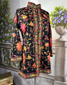 Experience the timeless elegance of our Traditional Kashmiri Floral Ari Embroidery Short Designer Jacket. Crafted with meticulous attention to detail, this versatile woolen coat features exquisite floral embroidery, reflecting the rich heritage of Kashmiri craftsmanship. With its button-up style and fully lined interior, it offers both sophistication and comfort. Elevate your winter wardrobe with this fine quality piece, blending traditional artistry with modern versatility effortlessly Conditio Designer Jacket, Work Shorts, Woolen Coat, Jacket Design, Winter Wardrobe, Up Styles, Floral Embroidery, Timeless Elegance, Bathing Beauties