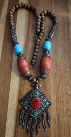 Vintage boho chic Tibetan necklace in very good Vintage condition. Tibetan Jewelry Boho, Traditional Turquoise Necklace With Wooden Beads, Bohemian Turquoise Necklace With Wooden Beads, Tibetan Necklace, Tibetan Jewelry, Tibetan Turquoise, Coral Pendant, Turquoise And Coral, Pretty Jewelry