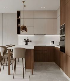 a kitchen filled with lots of counter top space next to a dining room table and chairs