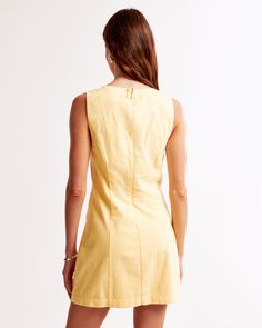 Brighten your wardrobe with the Abercrombie & Fitch Women's High-Neck Stretch Mini Dress in a vibrant Sunny Yellow. This chic, slim-fitting mini dress is perfect for any occasion, blending comfort and style seamlessly.

- Size: XL Petite
- Color: Sunny Yellow
- Material: Body - Cotton, Elastane
- Gender: Female
- Features: High-neck detail, flattering seaming details, non-functional front pockets

Crafted from a stretch-enhanced cotton fabric, this dress offers both flexibility and a flattering Fitted Cotton V-neck Mini Dress, Solid Cotton V-neck Mini Dress, Fitted Solid Color Cotton Mini Dress, Spring Stretch Mini Dress With Back Zipper, Lined Knee-length Mini Dress For Daywear, Cotton Stretch Mini Bodycon Dress, Stretch Cotton Mini Bodycon Dress, Cotton V-neck Mini Dress Lined, Lined Cotton V-neck Mini Dress