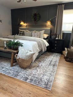 a large bed sitting on top of a wooden floor