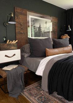 a bed sitting in a bedroom next to a wooden headboard and footstool