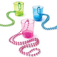 three different colored glasses with beaded necklaces and beads on the bottom one has a ball chain attached to it