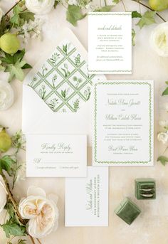 the wedding stationery was done in green and white, with greenery on top