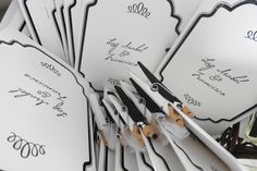 there are many scissors that have been placed in the center of each card for someone to put on their wedding day