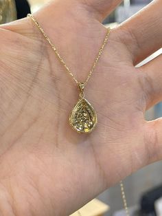 "Beautiful Pear Shape Diamond Necklace set in yellow gold. The diamonds are clear and very sparkling. Elegant and classy shape necklace. It's a nice size pendant, great to wear for any occasion. The diamond cut 14K Yellow Gold Chain has a nice sparkle to it and compliments the pendant perfectly. The chain is solid so it is strong. 18\" chain, let us know if you need a different length chain. Pendant length measures 22mm. The pear shape measures 16.2x12.5mm. Genuine Round Brilliant Cut Diamonds t Luxury Pear-shaped Yellow Gold Diamond Necklace, Pear-shaped Yellow Gold Diamond Necklace, Gold Teardrop Diamond Necklace With Prong Setting, Gold Diamond Necklace With Pearl Pendant, Fine Jewelry 14k Gold Pear-shaped Diamond Necklace, Yellow Gold Diamond Teardrop Pendant Necklace, Yellow Gold Teardrop Diamond Necklace With Prong Setting, 14k Gold Pear-shaped Diamond Necklace, Yellow Gold Pear-shaped Necklace With Rose Cut Diamonds