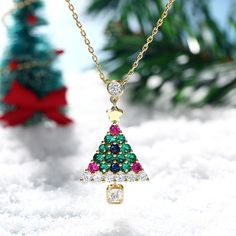 Enjoy the magic of Christmas with this spirited tree pendant. Bright and colorful, this Christmas tree pendant is sure to showcase your sense of holiday cheer. A combination of green, blue, red and white stones, the necklace will show a very sparkling look on your neck. A festive look that will go with any outfit, this sterling silver christmas tree necklace will be a lovely gift for her this December!Carat Weight: 3.615 ctStone Size: 4*4,2.8,3.5,2.8,2.8,2.8 mmStone Type: Jeulia® StoneNumber of Multicolor Christmas Jewelry Gift, Multicolor Jewelry Christmas Gift, Green Christmas Jewelry For Festive Occasion, Elegant Multicolor Jewelry For Holidays, Elegant Multicolor Holiday Jewelry, Green Festive Jewelry For New Year, Green Necklace Christmas Gift, Red Pendant Necklace For Christmas, Green Holiday Jewelry Gift