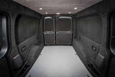 the inside of a vehicle with its doors open and seats folded back to reveal an entertainment area