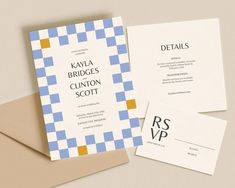 the wedding stationery is laid out on top of two envelopes, one with a checkerboard pattern