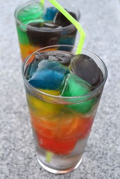 two glasses filled with different colored drinks