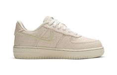 The Nike Stussy x Air Force 1 Low PS 'Fossil' is a stylish and comfortable sneaker perfect for kids. The woven hemp upper is soft and durable, while the tonal cream finish gives the shoe a clean, classic look. The double 'S' logo of iconic streetwear brand Stussy is stitched onto the toe box, and the Nike Swoosh is similarly formed with embroidered detailing. Additional branding hits include a metallic Stussy emblem on the heel tab and a woven World Tour tag atop the tongue. This sneaker is perf Stussy Af1, Nike Low-top Sneakers With Embossed Logo, Nike X Stussy Shoes, Air Force 1 Stussy Fossil, Air Force 1 Stussy Black, Air Force 1 Low, Comfortable Sneakers, Air Force 1, Classic Looks