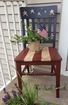 an american flag potted on top of a wooden chair