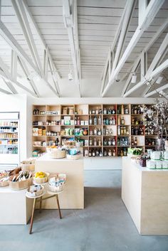 a store filled with lots of different types of food and drink on shelves next to each other