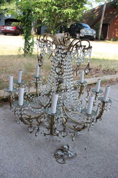 a chandelier is sitting on the sidewalk outside