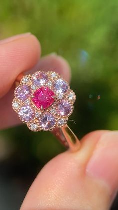 Pink Round Cluster Ring With Prong Setting, Pink Round Cluster Ring With Halo Setting, Pink Sapphire Promise Ring With Halo Setting, Pink Cluster Ring With Center Stone, Pink Ruby Rings With Brilliant Cut, Pink Ruby Ring With Brilliant Cut, Pink Ruby Rings With Prong Setting, Pink Fine Jewelry Ring With Center Stone, Pink Cluster Ring With Halo Setting