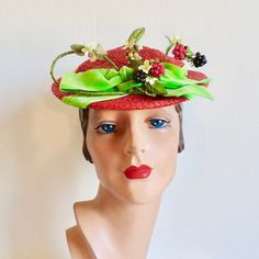 "A very whimsical hat from the 1950's from a well known Hollywood milliner. Made in a red woven synthetic straw. Shallow crown and a small brim. Adorned with faux blackberries, rasberries, and yellow berries as well as small yellow fabric flowers, stems and leaves. Also trimmed with a lime green velvet ribbon around the crown and a bow at the front. Interior hat has a green velvet head holder that anchors to the back of the head. Red grosgrain ribbon trims the inside crown. Label:  Caspar Davis Green Velvet Ribbon, Large Brim Hat, Types Of Hats, Hollywood Fashion, Yellow Fabric, Ribbon Trim, Velvet Ribbon, Brim Hat, Green Velvet