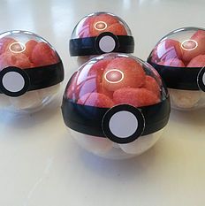 four pokeballs sitting on top of a table