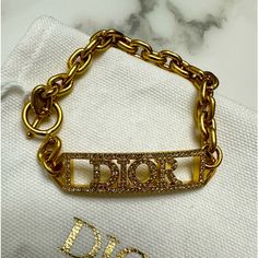 Brand New With Tags. 100% Authentic Dior Id Bracelet Style B1628dvocy The Dio(R)Evolution Bracelet Is Distinguished By Its Modern And Sophisticated Allure. The Gold-Finish Metal Design Reveals Chain Links And Is Further Embellished With A Silver-Reflective Crystal Pav ‘Dior’ Signature. Features Silver-Tone Crystals ‘Dior’ Signature Gold-Finish Metal Toggle Clasp Comes Exactly As Shown In Photos. Includes Dior Storage Bag. Designer Gold Bracelets With Logo Charm, Luxury Bracelets With Logo Charm As Gift, Designer Bracelets With Diamond Accents, Designer White Gold Bracelets For Everyday Luxury, Designer Gold Bracelets, Dior Jewelry, Bracelet Style, Id Bracelets, Chain Links