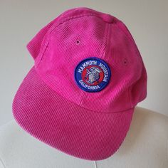 Electric pink corduroy hat with a patch on the front advertising Mammoth Mountain in California. The underside of the brim is a green and the hat has a pink adjustable back. Brand: No tag. Material: 100% Cotton Size: One Size with adjustable back. Adult size. Condition: Excellent vintage condition! Pink Adjustable Flat Cap, Adjustable Pink Flat Cap, Retro Pink Cotton Hat, Pink Vintage Adjustable Baseball Cap, Casual Pink Hats With Logo Patch, Retro Pink Hat For Streetwear, Pink One Size Fits Most Flat Cap, Mammoth Mountain, Corduroy Hat