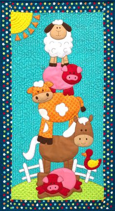 a quilted wall hanging with farm animals and sheeps on it's sides