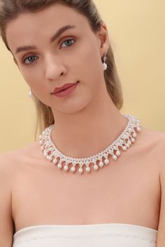 Embrace the opulence of our Vintage Triple-Layer Handcrafted Pearl Necklace, ideal for banquets and weddings. This exquisite piece features three sizes of near-round and oval-shaped pearls, meticulously handcrafted into a luxurious three-layer design. The necklace measures 40cm with an additional 5cm extension, offering flexibility and a perfect fit for any formal attire. Product Details: Pearl Types: Various Sizes, Near-Round and Oval Shapes Craftsmanship: Pure Handcrafted Style: Vintage Luxury Luxury Oval Bridal Necklace, Luxury Teardrop Pearl Necklace, Luxury Pearl Charm Necklace For Evening, Luxury Teardrop Bridal Necklace For Wedding, Elegant Oval Bridal Necklace For Formal Occasions, Graceful Pearl Jewelry For Party, Luxury Pearl Drop Necklace For Evening, Pearl Necklace For Celebrations, Luxury Pearl-embellished Jewelry For Evening