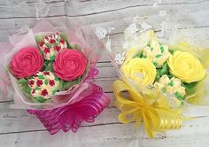 two bouquets of flowers sitting next to each other on top of a wooden table