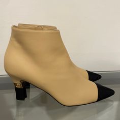 Brand New Chanel Boots, Beige With Black Toe And Heel, Gold Chanel Insignia On Boot Heels. I’m A Size 8.5 In Average Us Shoes And These Fit Perfectly. Never Worn, Just Tried On In The Store And At Home On Carpet. Bought Them At Chanel In Holt Renfrew In Toronto Two Weeks Ago. Elegant Ankle-high Boots With Rubber Heel Cap, Beige Ankle Boot Heels For Evening, Beige High Heel Evening Boots, Beige High Heel Boots For Evening, Beige Pointed Toe Heeled Boots For Evening, Elegant Booties With Padded Ankle And Round Toe, Elegant Beige Round Toe Booties, Chic Beige Evening Boots, Elegant Beige High Heel Booties