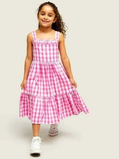 Decorated in all-over checks, this tiered dress from our own collection is made from pure cotton that's soft against little one's skin. Fully lined for ultimate comfort, it's defined by smocked back detailing and a flared bottom tier. Pair with pumps for the perfect look. Details: 100% Cotton Cute Gingham Smocked Dress With Ruffles, Spring Cotton Smocked Tiered Dress, Spring Cotton Tiered Smocked Dress, Spring Tiered Cotton Smocked Dress, Cotton Tiered Dress With Smocked Bodice, Summer Gingham Seersucker Dresses, Cotton Gingham Smocked Dress With Ruffles, Gingham Tiered Ruffle Dress, Cotton Smocked Dress With Ruffles In Gingham